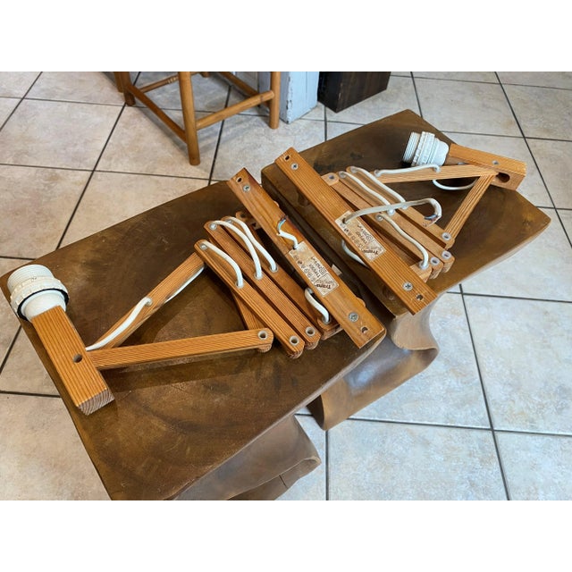 Pair of articulated pine wood accordion wall lights from Translandia, Denmark, Scandinavian, vintage 1960s. These wall...