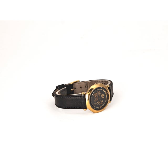 Vintage women's wristwatch by Laura Biagiotti (1990s), featuring Italian design and a Swiss quartz movement. The key...