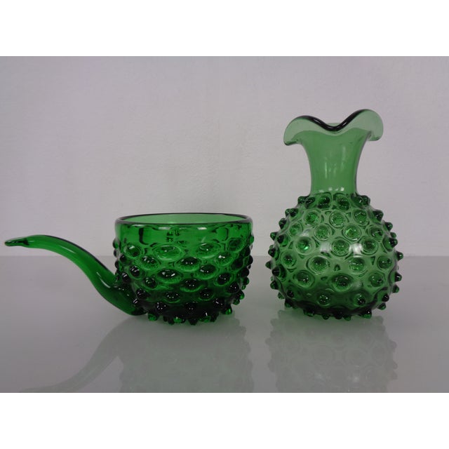 Bubble vase and bowl in green glass by Empoli, dating from the 1960s. Vase height: 17 cm. Width and depth: 12 cm. Bowl...