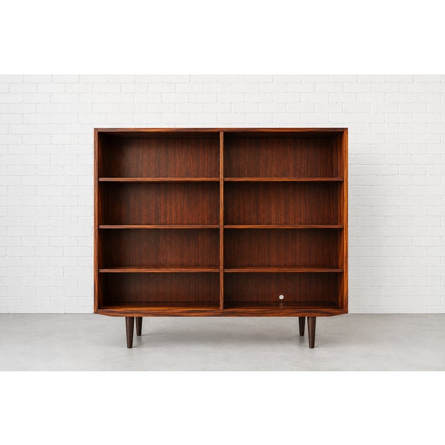 Exquisite Mid Century Modern ROSEWOOD bookcase featuring 8 wide and spacious shelving areas, stunning wood grains...
