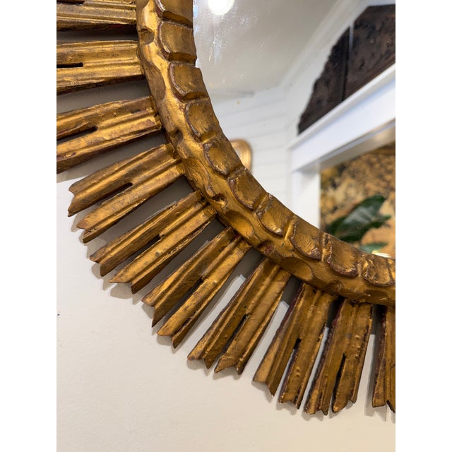 This is a gorgeous gilt wood mirror! Done in sunburst style, there are several rays that allow for lovely overall sunburst...