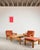 An exceptionally rare, complete lounge set by Tage Poulsen, consisting of two lounge chairs, a matching ottoman, and the...
