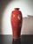 This large red glazed ceramic vase, hand-thrown by British studio potter David Frith at Brookhouse Pottery circa 1980s, is...