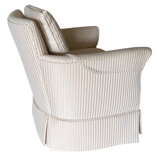 Gorgeous condition! Comfortable pair of club chairs featuring rolled arms, a tailored skirted base, and soft neutral...