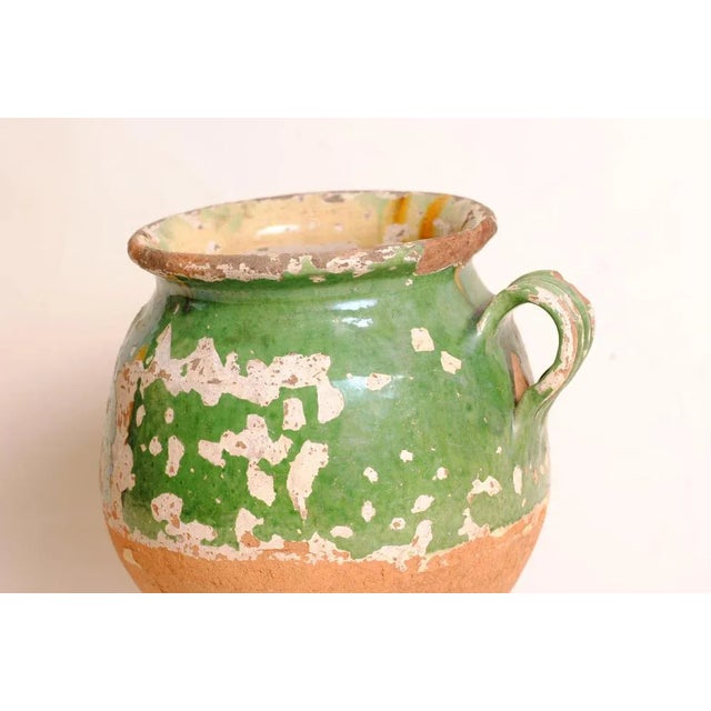 A French terracotta pot with a rare green glaze from southwest France. This is a superb piece, rare because of its green...