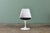 A nice set of recent Knoll Saarinen Tulip chairs with black leather seat cushions. The chairs and cushions are are labeled...