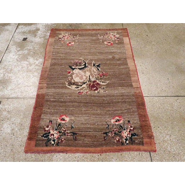 This mid-20th century Turkish Anatolian rug, measuring 3' 4" x 5' 1", showcases a striking minimalist composition rooted...