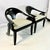 Vintage Home is pleased to present this stunning pair of hand-carved espresso stained teak curled arm Spoon Chairs. The...
