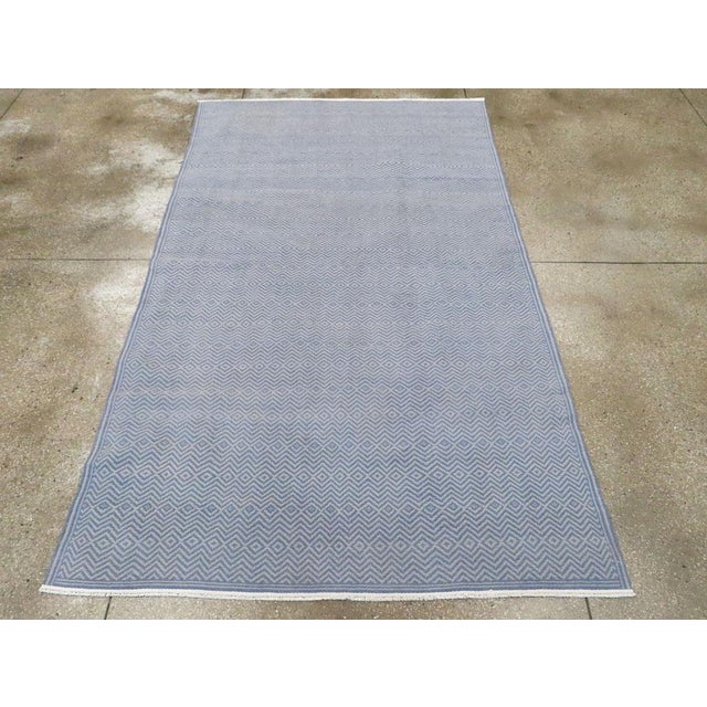 A Vintage Persian Flatweave Kilim accent rug handmade during the Mid-20th century. Measures: 5' 10" x 9' 10"