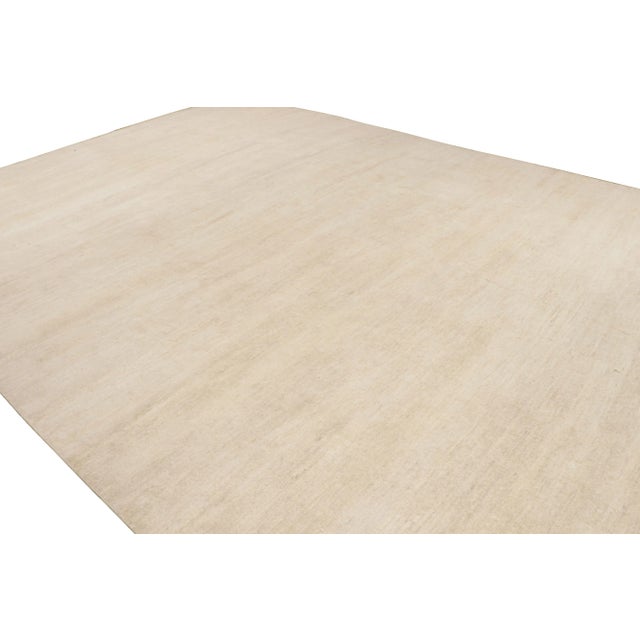 A modern textural rug from our Texture of Color line in this collection—hand-knotted in silk, this 14x19 oversized rug...