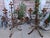 A pair of magnificent candlesticks made of hand-forged iron with gold leaf, which have developed a wonderful patina over...