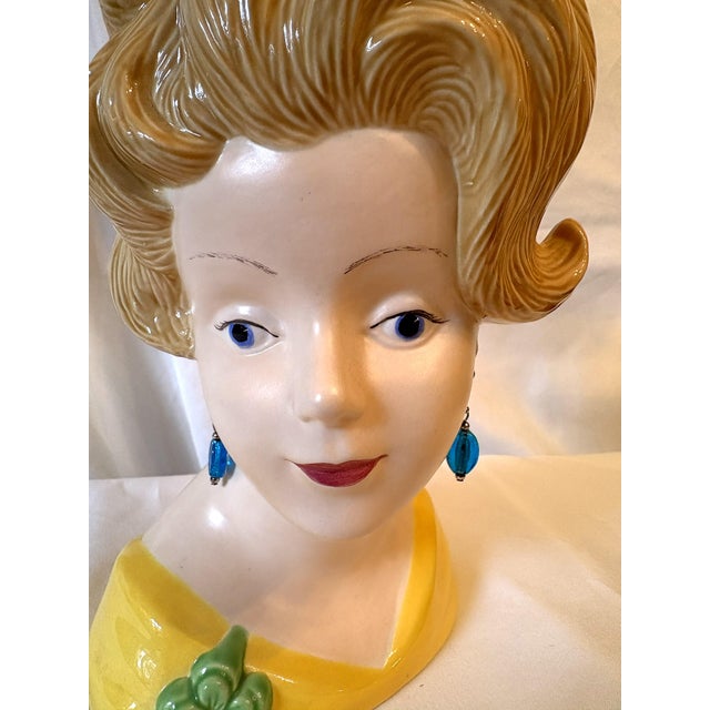 Fun mid-century retro head vase from the 1970's. The piece is made of ceramic in the shape of a lady bust with sculpted...