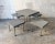 Table with four stools with chromed metal legs, top coated tapisom. the periscopic table legs allow him to have both the...
