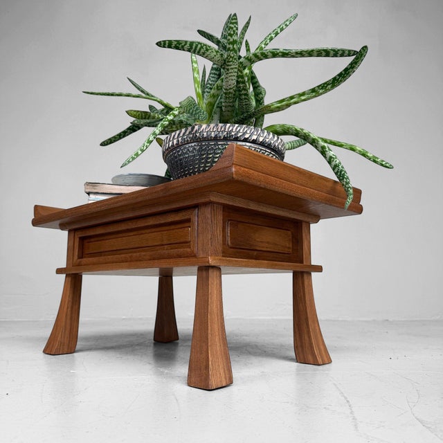 An elegant small Japanese display table with one drawer, warm wood tones and a refined classical design. Dimensions:...