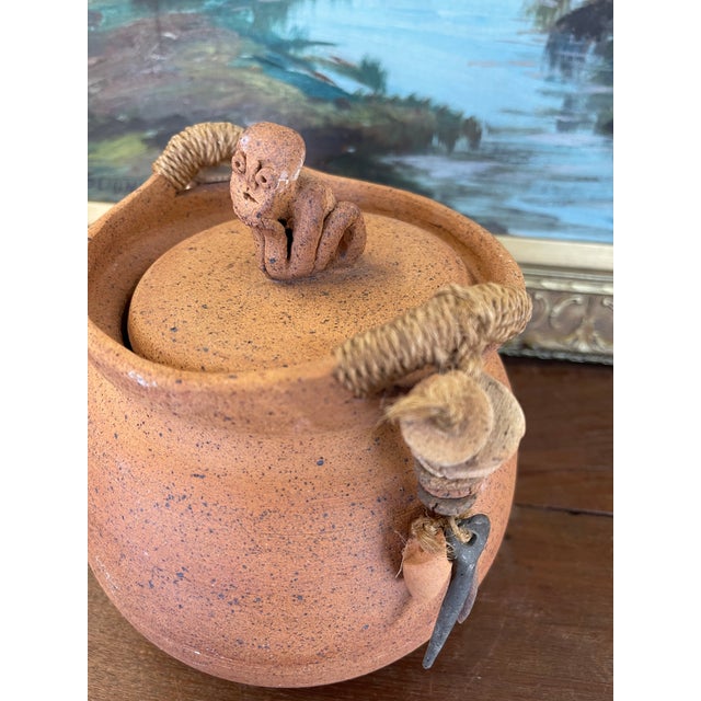 1970s Handmade Indonesian Terracotta Lidded Jar With Beaded Raffia Accents and Seated Figure Finial For Sale - Image 9 of 9