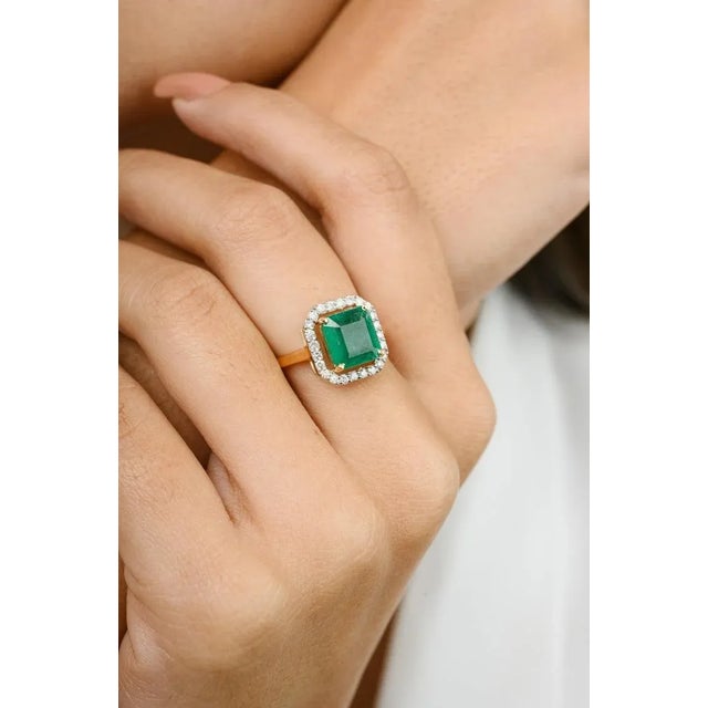This is part of Chairish’s Fine Jewelry assortment. Certified 2.7 Carat Octagon Emerald Halo Diamond Wedding Ring in 18K...