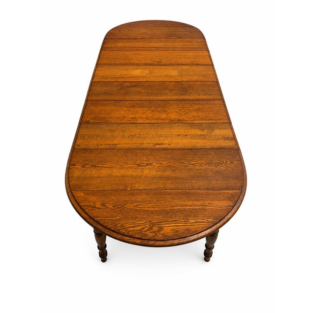 English Antique Solid Oak Extension Dining Table With 6 Original Leaves & Original Wooden Casters Circa 1940s–1950s For Sale - Image 3 of 7