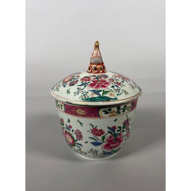 A Chinese porcelain bouillon pot with Famille Rose enamels, East India Company, 18th century. Decorated with floral...
