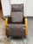 Design Plus Gallery presents a JXP Rocking Massage Chair. This chair has brown upholstered leatherette cushioning, a...