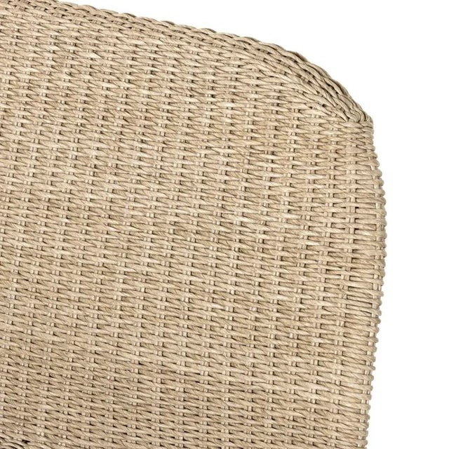 Based off a vintage shape, all-weather wicker seating brings dramatic curves to this statement-making dining bench....