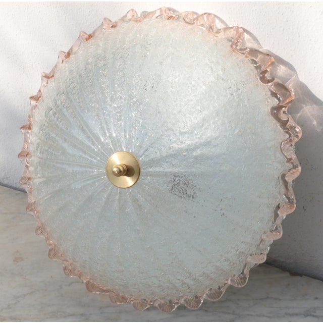 Stunning pink and transparent/silver Murano ceiling light. The central plate is surrounded by a wavy pink stripe typical...