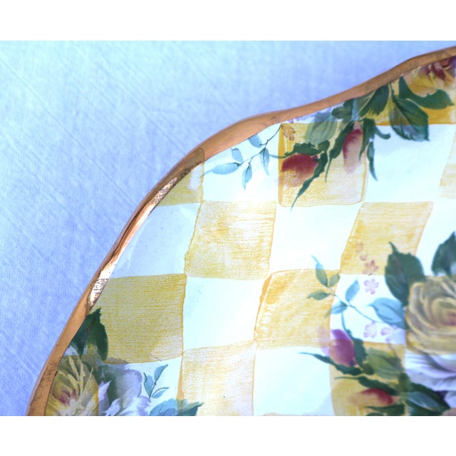 The MacKenzie-Childs Honeymoon Dandy Lion yellow scalloped platter is a handmade ceramic piece featuring the Dandy Lion...