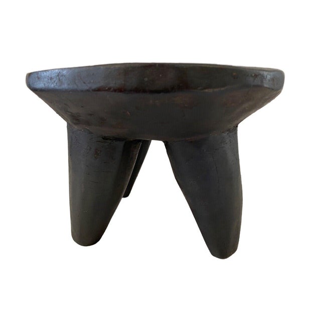 The stool was refinished and waxed ready to be used Superb African Senufo kids milk stool on four tapered legs with an...