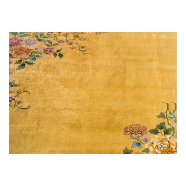 A simple but chic early 20th century Chinese Art Deco rug with two large floral clusters in opposite corners, one with...