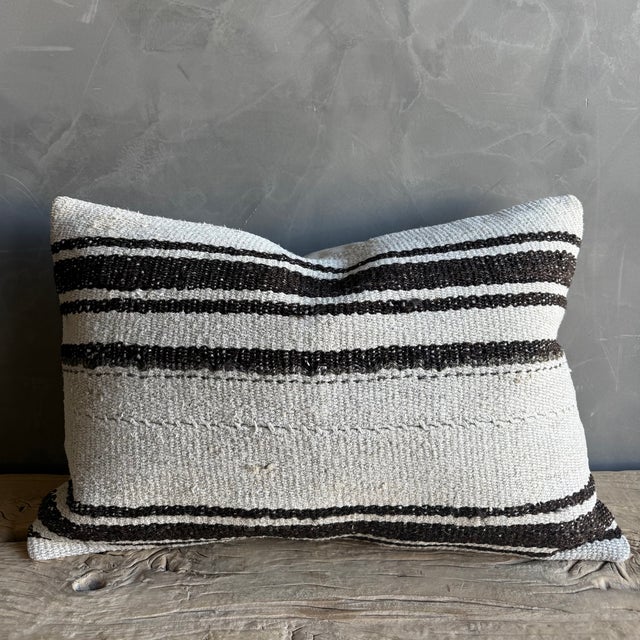 Creamy white hemp rug pillow. Soft hand, linen blend backing with zipper closure. Spot cleaning is recommended, or dry...