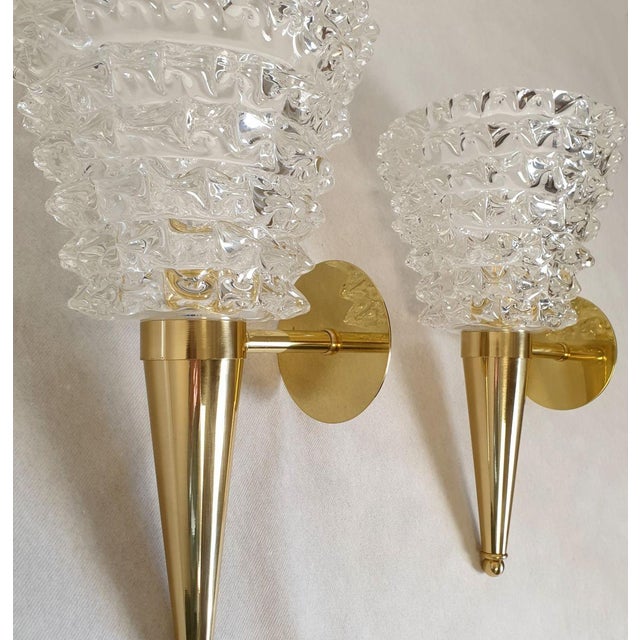 Pair of Mid Century Modern Murano glass and brass sconces, Barovier & Toso style Italy 1980s. The Mid-Century wall lights...