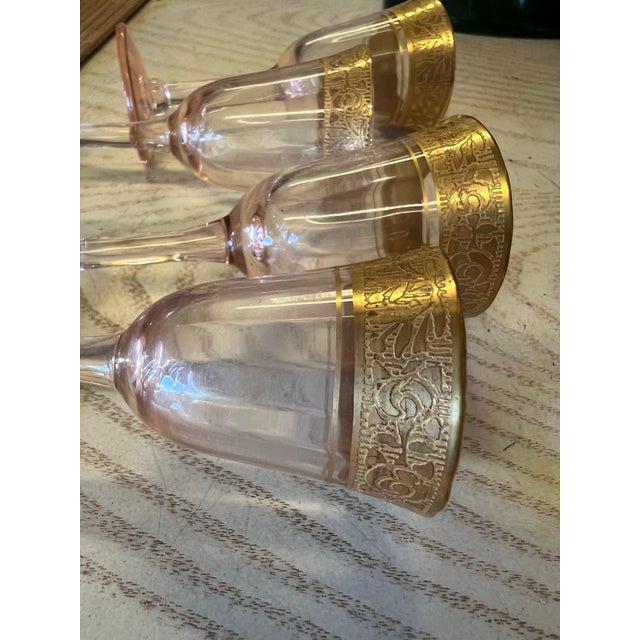 Beautiful set of 4 Blown Pink Glassws with Gold Encrusted band around the rim. Made by Tiffin-Franciscan. Height: 3 3/8 in...