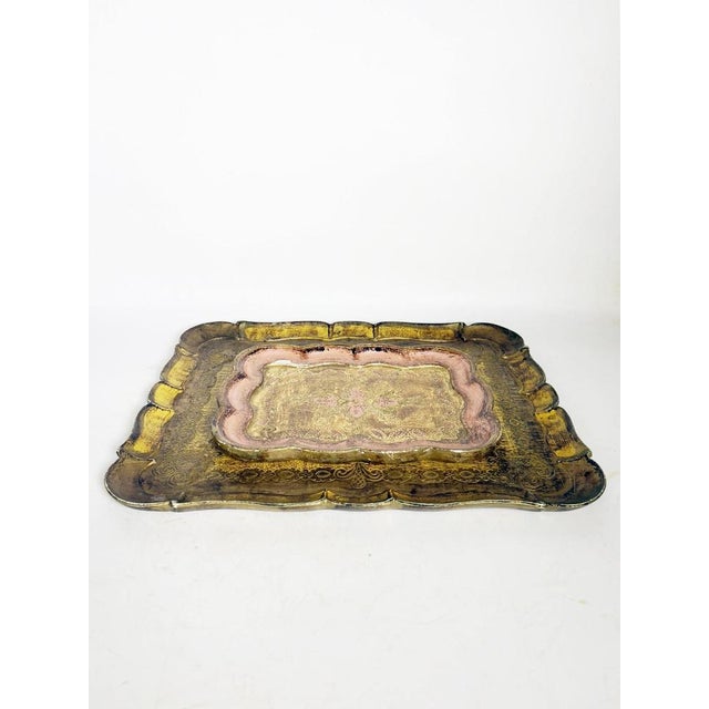 A set of two giltwood trays, India, 20th century, with richly ornamented, classically inspired decoration. Each tray...