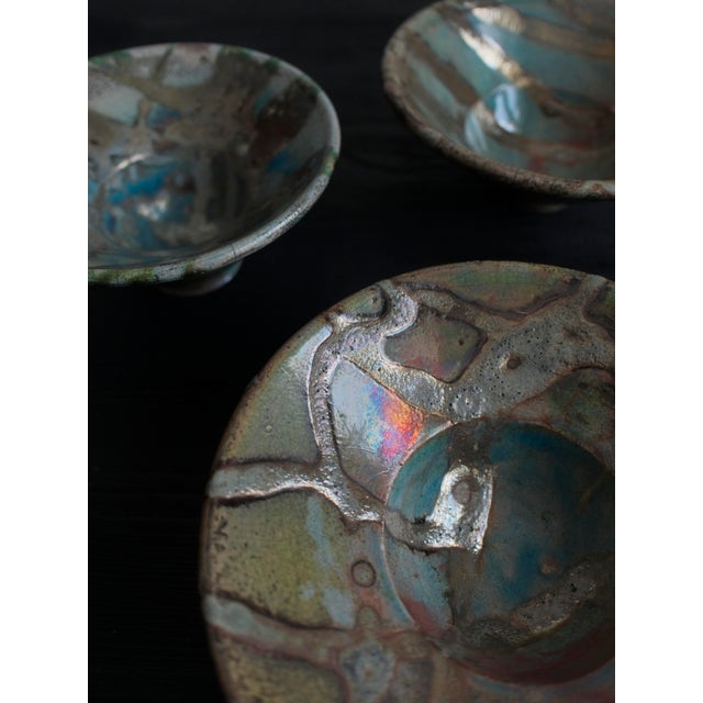Vintage hand thrown set of three eclectic Japandi style bowls. with distinctive blue, green and orange irregular textured...