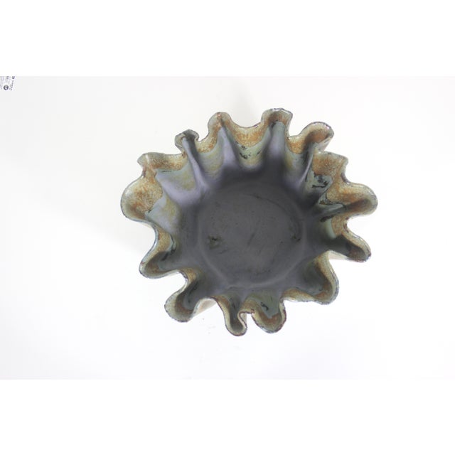 Fabulous vintage handmade studio pottery bowl with a sculptural ruffled edge and four feet. Very useful size for salad,...