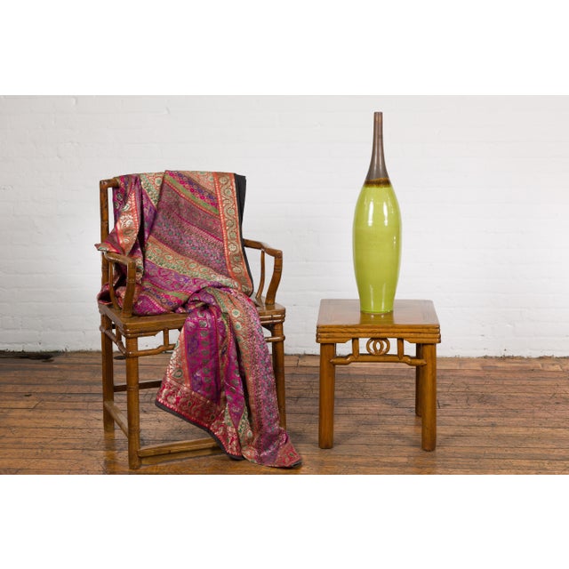 A contemporary lime green glazed slender ceramic vase with brown neck and tapering lines. Elevate your interior decor with...