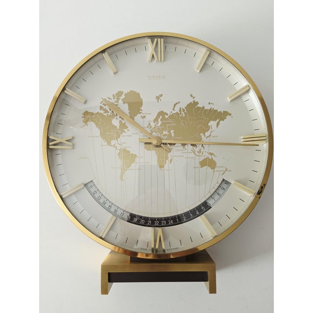 A large, heavy table or mantel clock designed by Heinrich Möller for Kienzle International in the 1950s or 1960s. The...