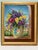 A charming vintage floral still life oil painting signed Gzaugg, depicting a lush bouquet of colorful flowers in a hand-...