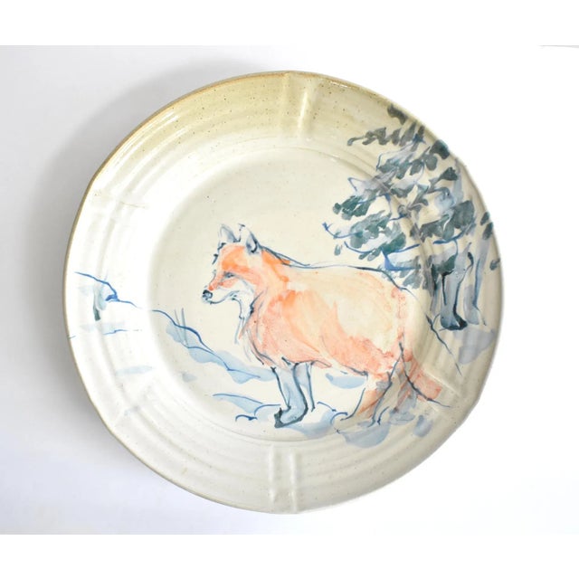 An extra-large ceramic earthenware pottery charger or platter, wheel-thrown and hand-painted with an orange fox on a green...