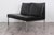 Used sofa with original black faux leather and chrome-plated metal frame. Completely original in beautiful visual...