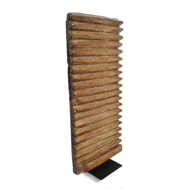 Vintage wooden carved washboard from the Baule people of Western Africa. Displayed on iron stand as unique art with...