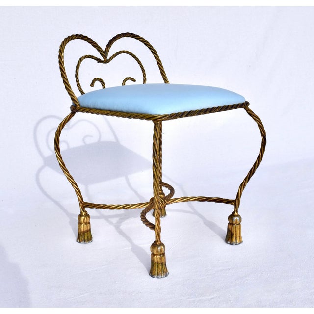 1950's Hollywood Regency enameled gold gilt metal rope & tassel stool with new powder blue velvet upholstery. Rich in...