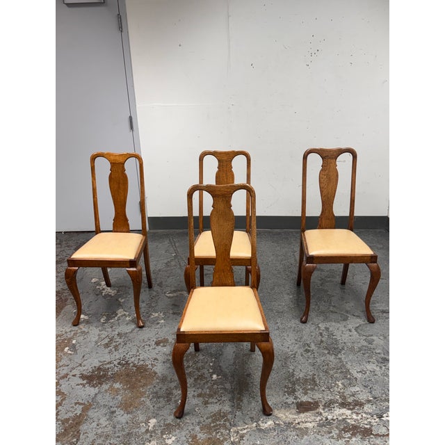 Design Plus Gallery presents Set of Four Antique Queen Anne Dining Side Chairs. Showcasing classic Queen Anne silhouettes,...