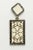 Pair of fascinating dangle earrings in white enamel with a floral and paisley design. Bordered with round, brilliant cut...