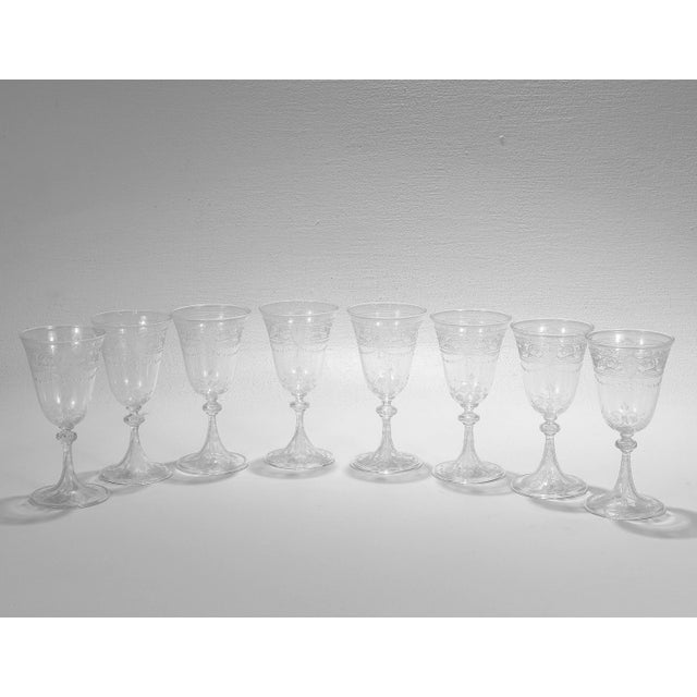 A fine set of antique etched and engraved glass wine glasses. Attributed to Stevens & Williams or Webb. With engraved &...