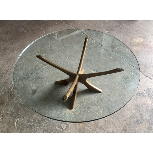 Iconic coffee table, model t118, designed by danish designer illum wikkelsø around 1960. The distinctive, sculptural base...