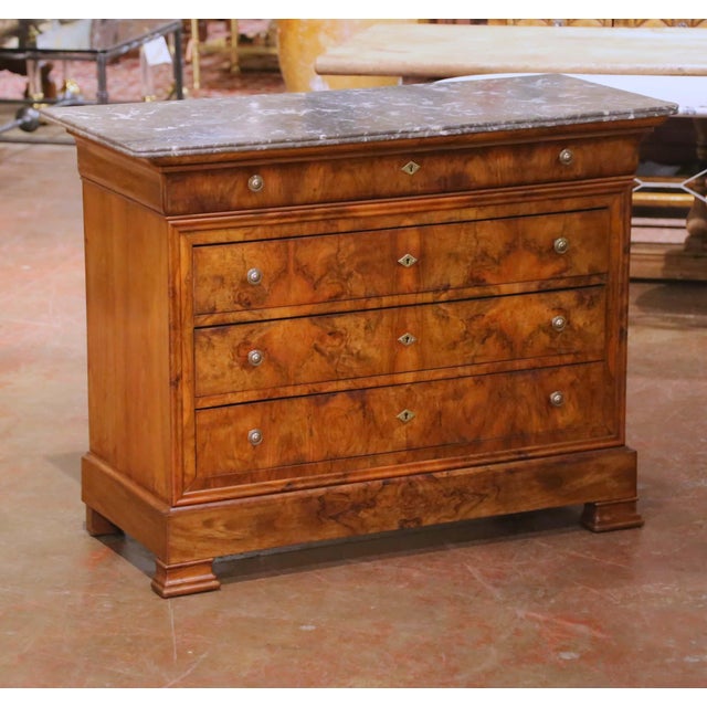 Crafted in France circa 1850, this elegant Louis Philippe commode features a refined architectural silhouette and the rich...