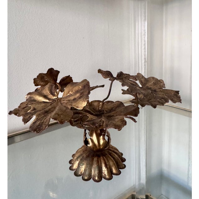 Beautiful brass candleholder with a floral motif. Some oxidation/patina, but in excellent condition.