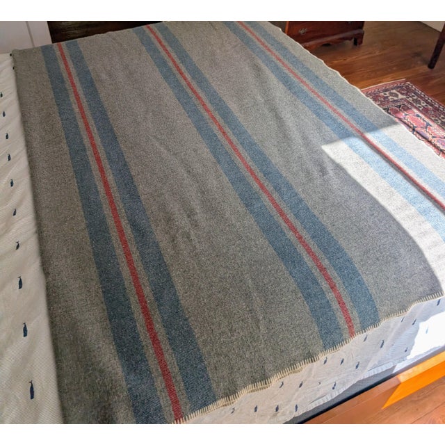 90 x 62 grey wool blanket beautiful red and blue stripes fully intact whipstich around the edges