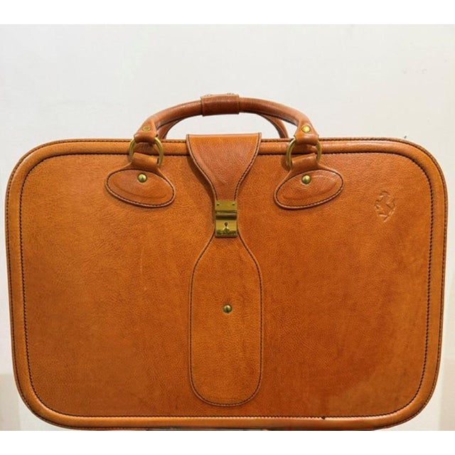 Leather suitcase from the renowned Modena-based company Schedoni, which produces custom leather interiors and sets for the...
