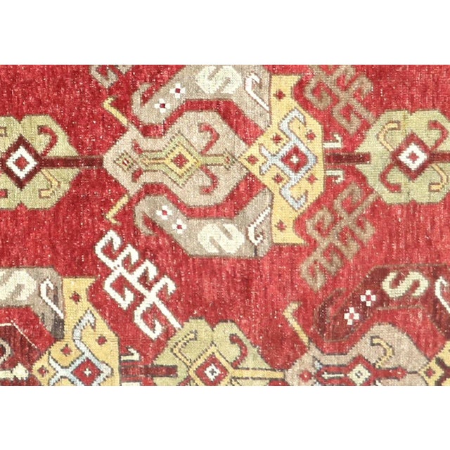 This beautiful vintage Turkish Oushak Rug is hand-knotted with 100% wool on a wool foundation to provide a soft, warm...